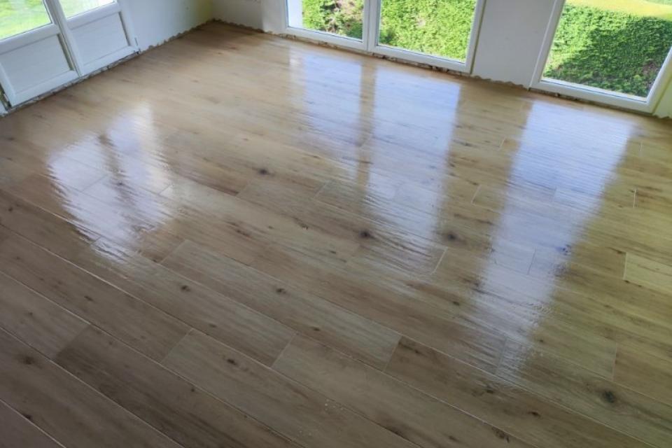 Pose d'un carrelage imitation parquet dans deux chambres à Octeville-sur-mer